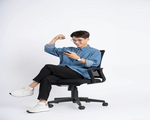 Person doing simple standing stretches beside an office chair